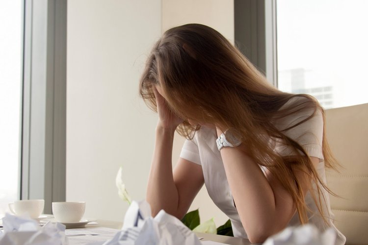 a woman experiencing a headache